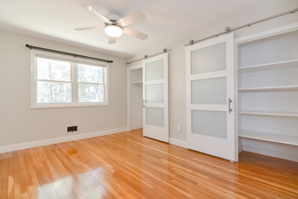 2054 Main Street Concord, MA 01742 - Photo 37 of 41 a view of an empty room with a window and wooden floor