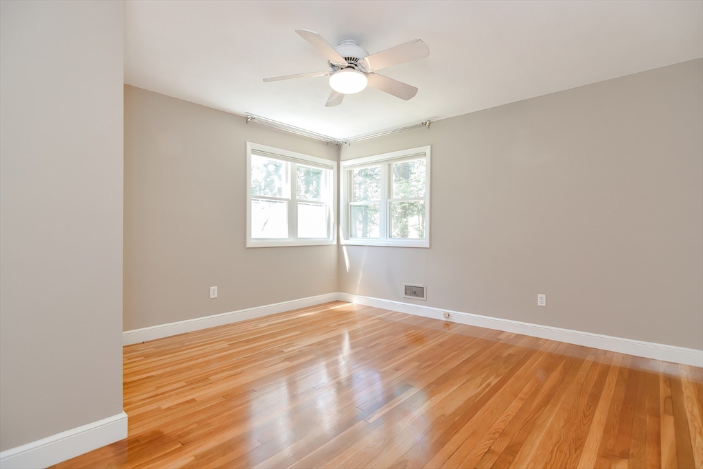 2054 Main Street Concord, MA 01742 - Photo 38 of 41 wooden floor in an empty room with a window