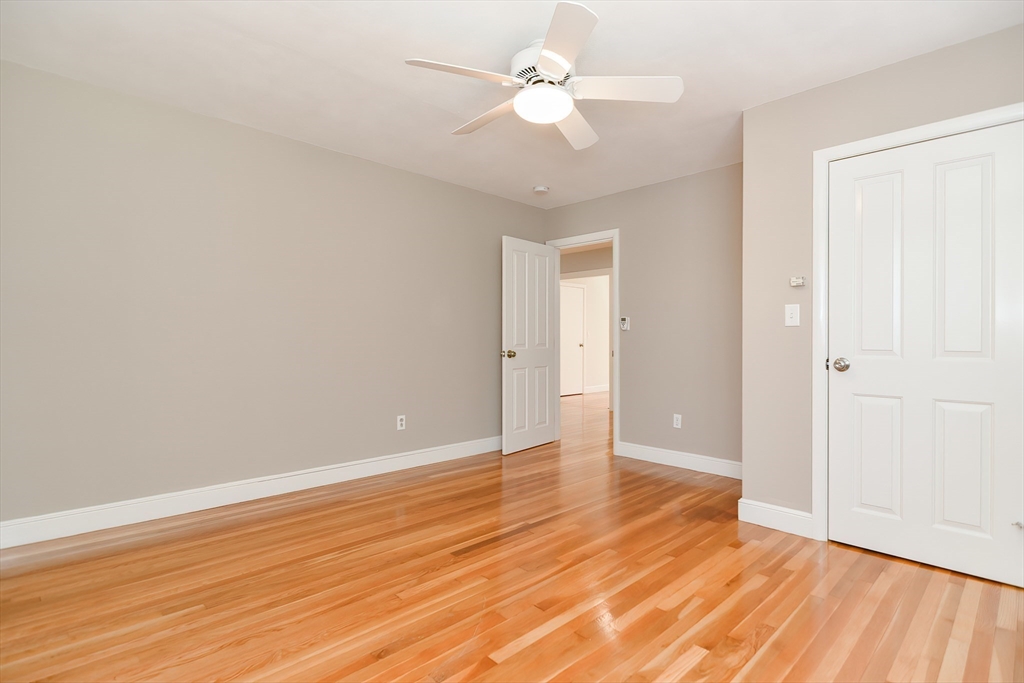 2054 Main Street Concord, MA 01742 - Photo 39 of 41 an empty room with wooden floor and a ceiling fan