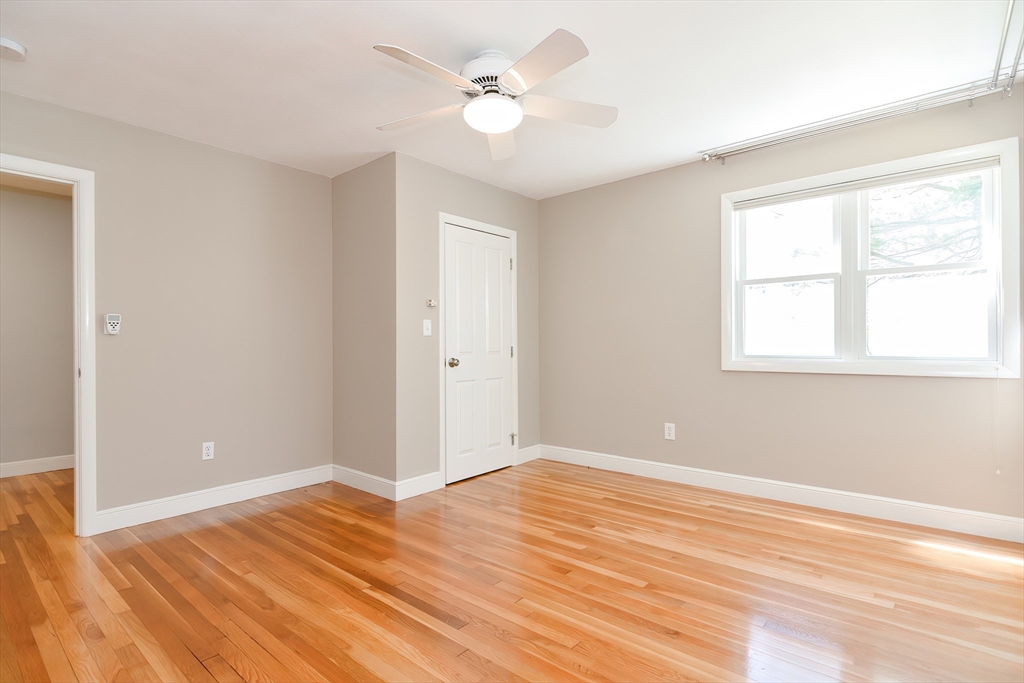 2054 Main Street Concord, MA 01742 - Photo 40 of 41 a view of a room with wooden floor and a ceiling fan