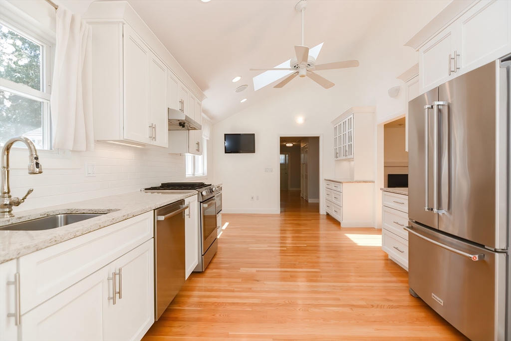 2054 Main Street Concord, MA 01742 - Photo 8 of 41 a kitchen with stainless steel appliances a refrigerator sink and microwave