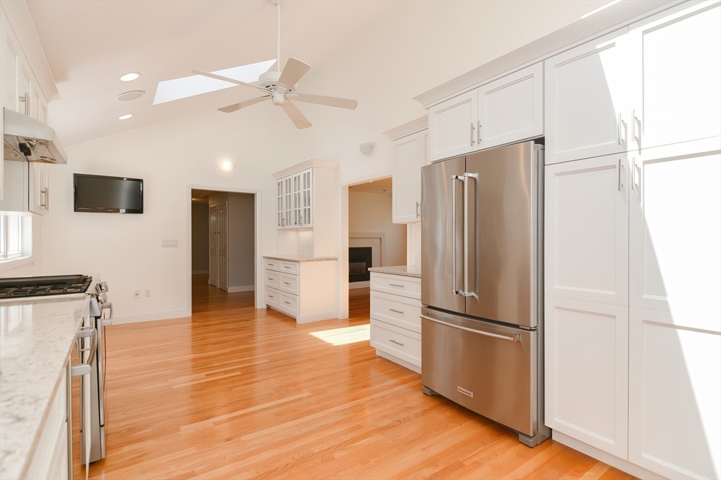 2054 Main Street Concord, MA 01742 - Photo 9 of 41 a large kitchen with stainless steel appliances a refrigerator and a stove top oven