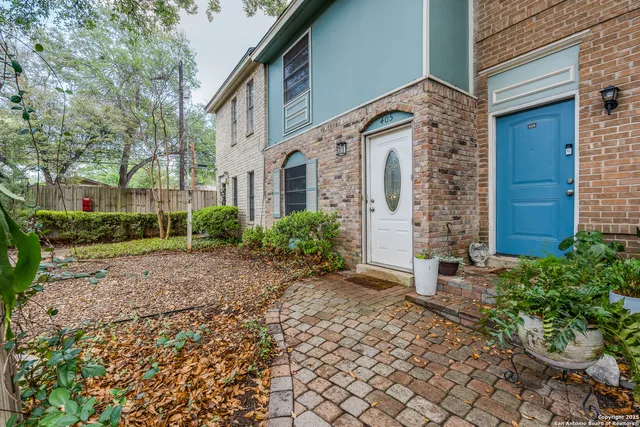 a brick building with a yard