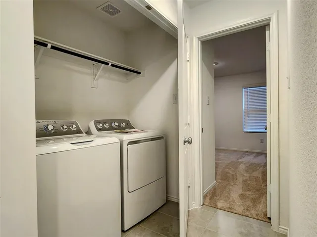 a utility room with dryer and washer