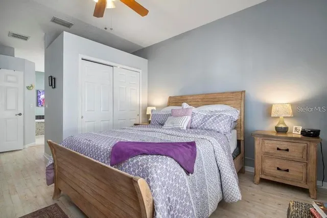 a bed room with a bed and a tv