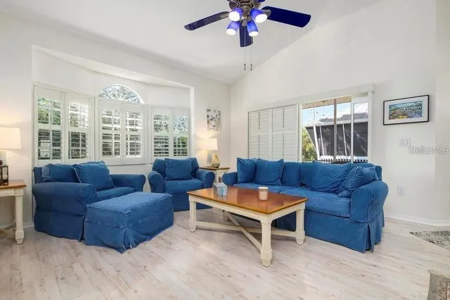 a living room with furniture and a large window
