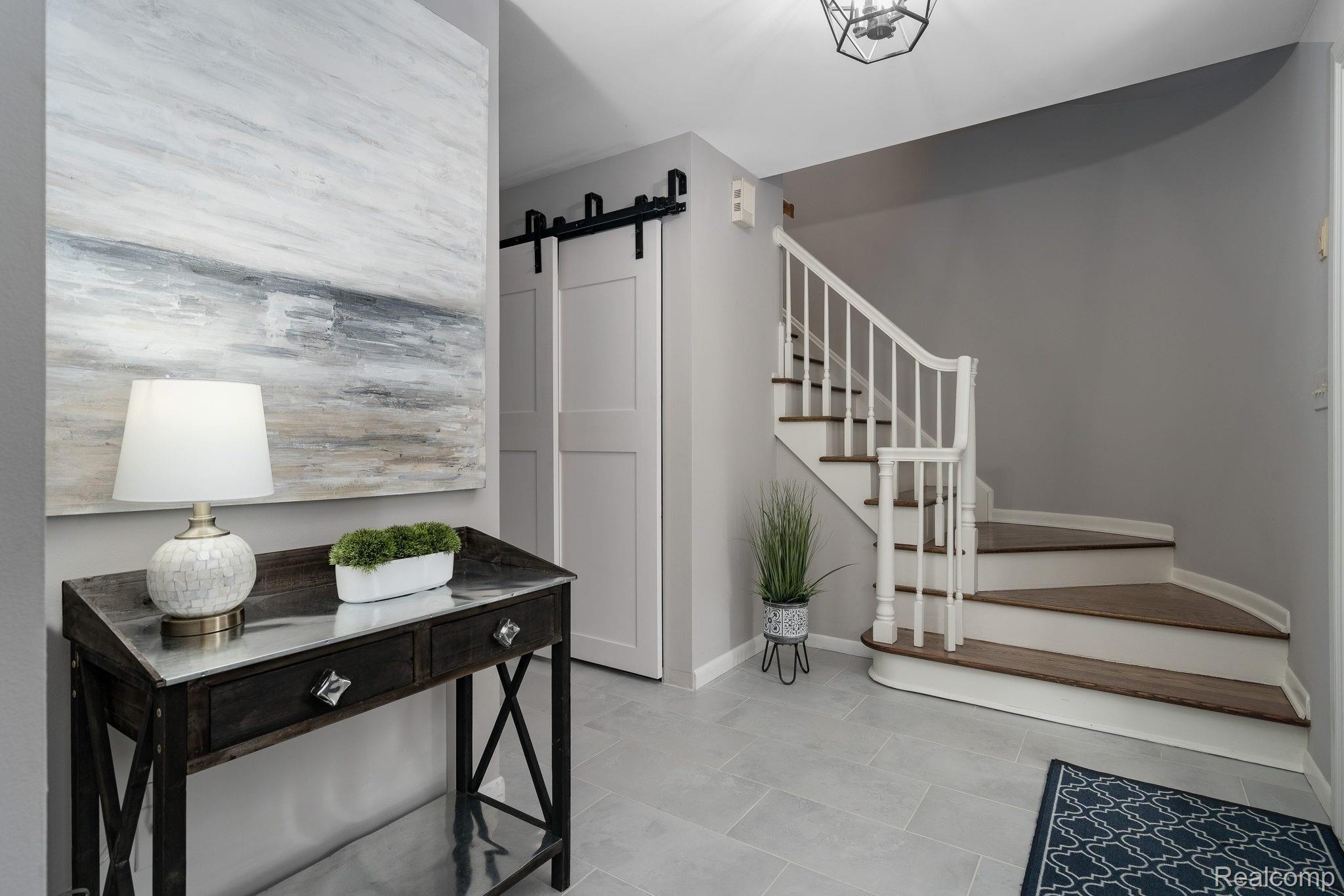 1100 Kingsview Avenue Rochester, MI 48309 - Photo 10 of 48 Stunning Entry with Curved Staircase and Barn Door Closet
