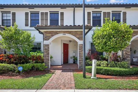 front view of a house with a garden