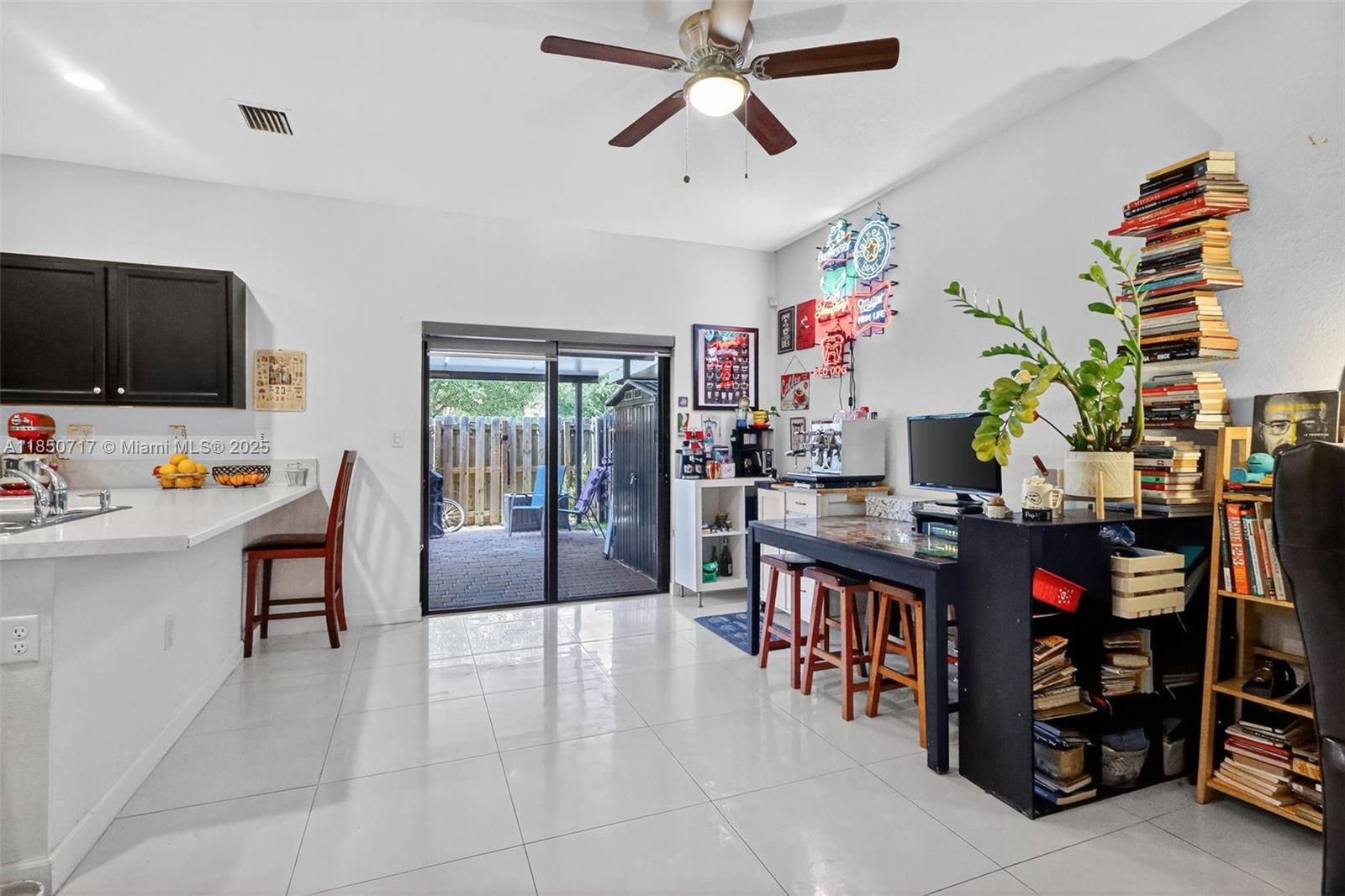 11418 Southwest 250th Street Homestead, FL 33032 - Photo 11 of 60 a living room filled with furniture and a flat screen tv