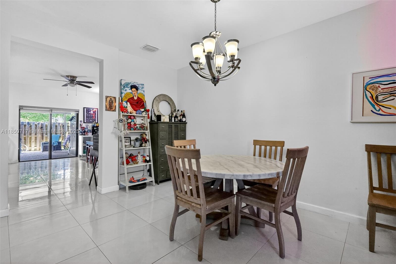 11418 Southwest 250th Street Homestead, FL 33032 - Photo 14 of 60 a view of a dining room with furniture
