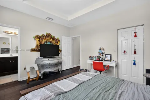 a bathroom with a sink a toilet a shower and a mirror