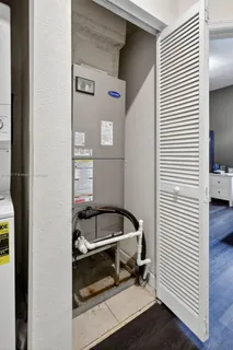 a bedroom with a bed and a table in it