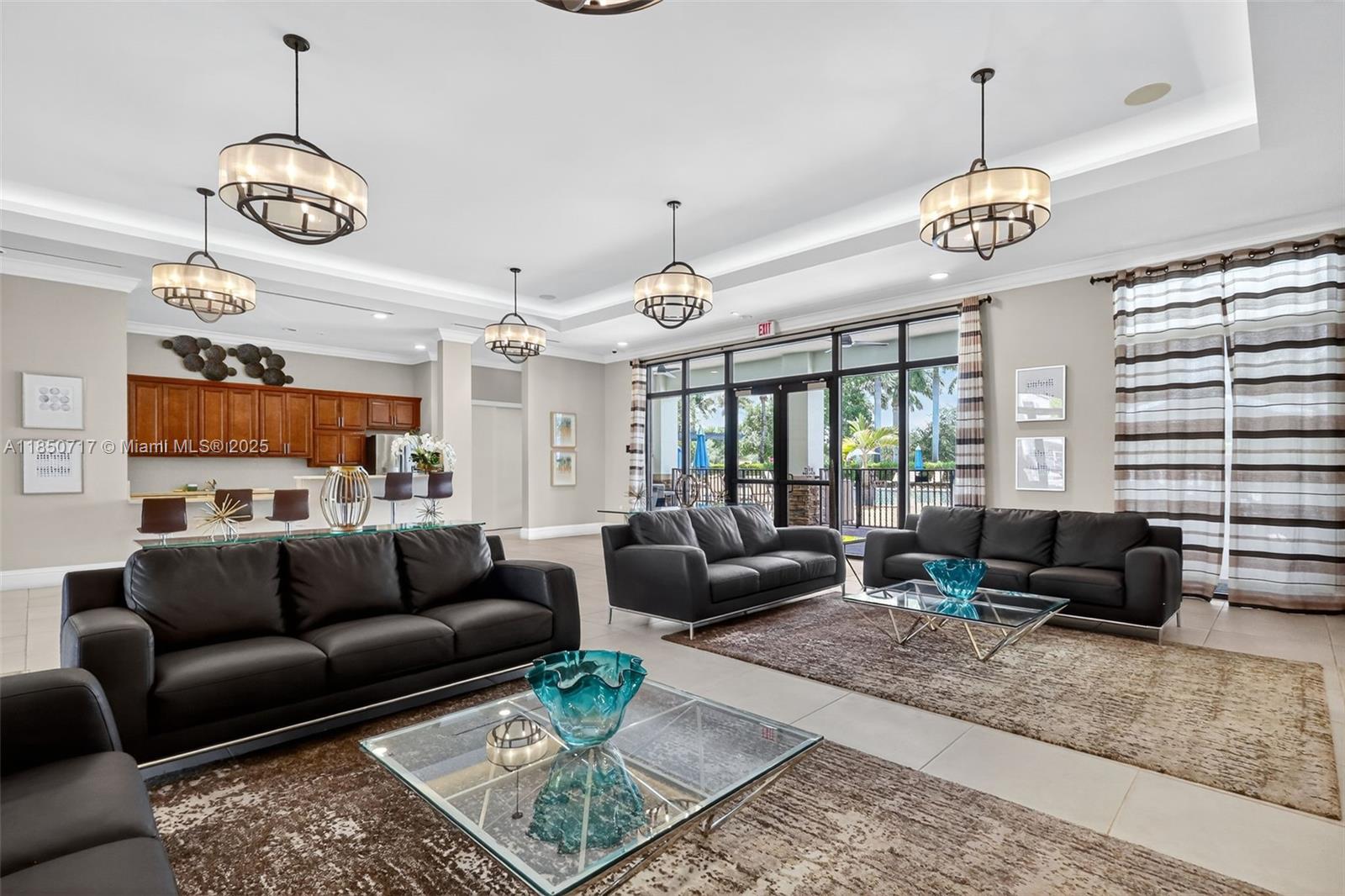 11418 Southwest 250th Street Homestead, FL 33032 - Photo 40 of 60 a living room with furniture chandelier and a table
