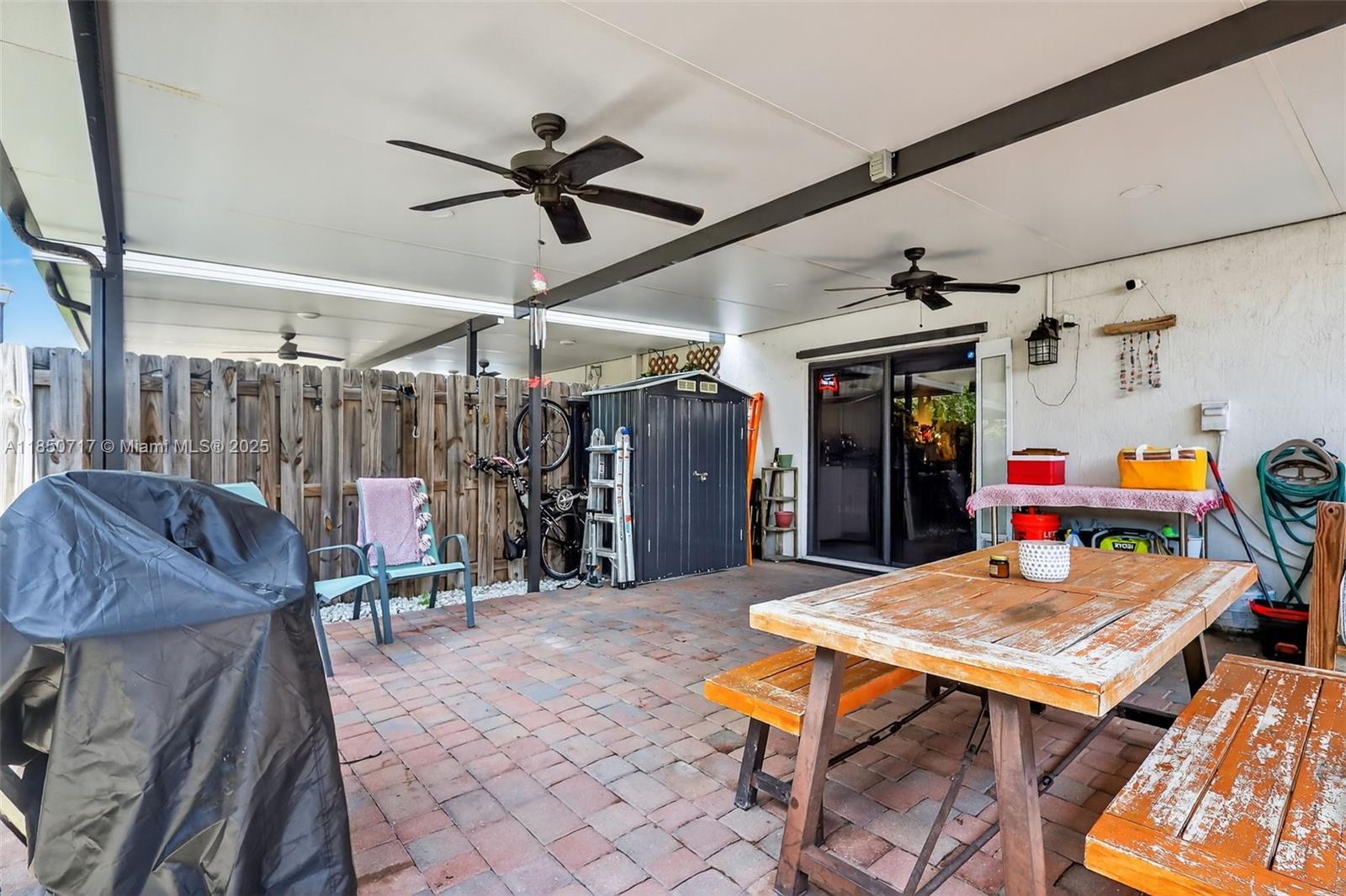 11418 Southwest 250th Street Homestead, FL 33032 - Photo 41 of 60 a outdoor space with a table tennis table and chairs