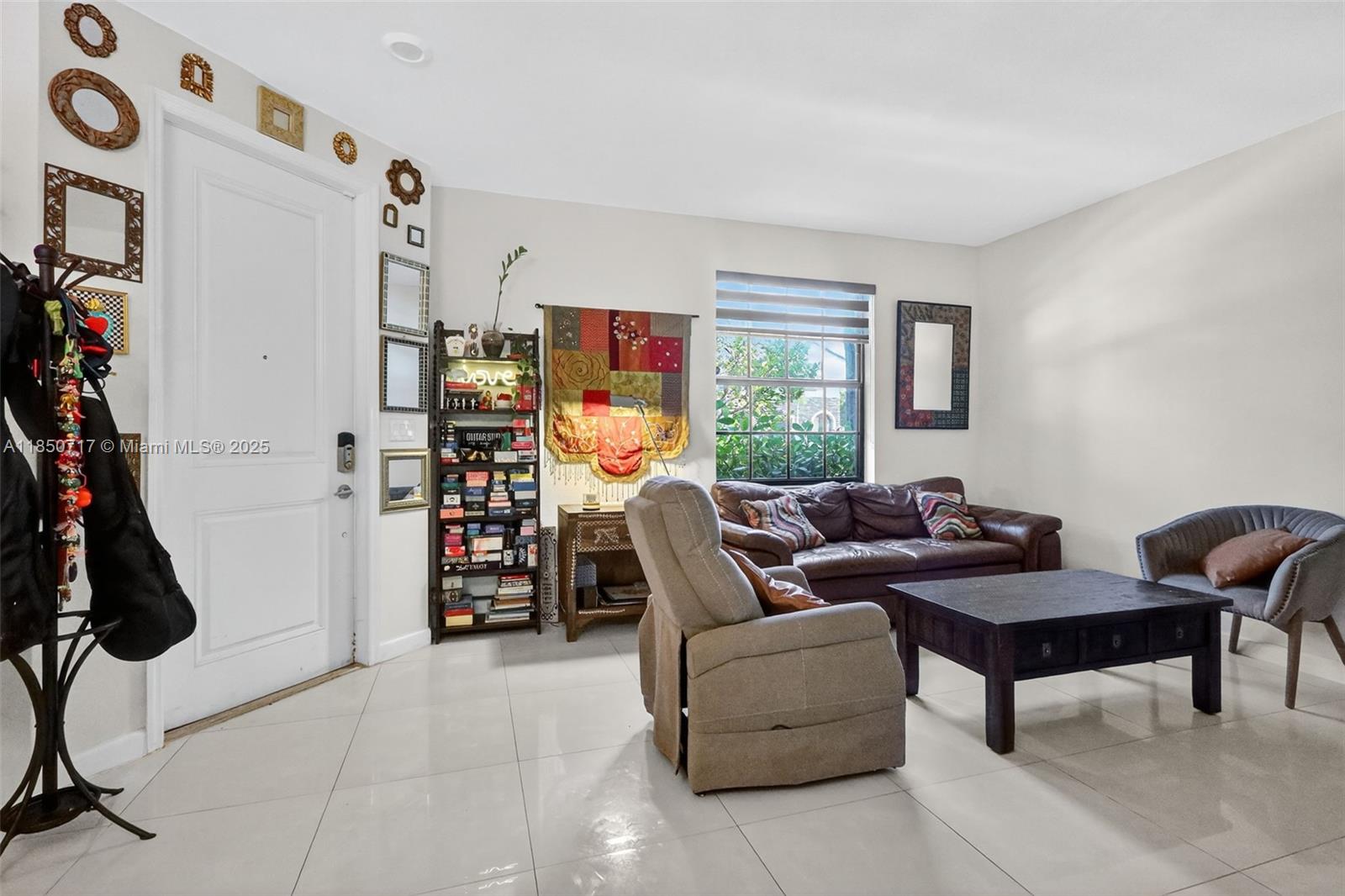 11418 Southwest 250th Street Homestead, FL 33032 - Photo 5 of 60 a living room with furniture and a window