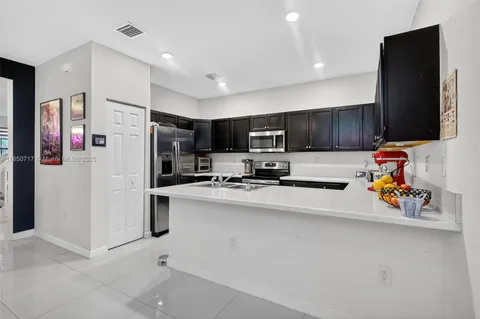 a living room filled with furniture and a flat screen tv