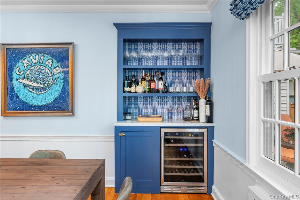 49 Eton Road Larchmont, NY 10538 - Photo 11 of 34 a room with wine cabinets and a window