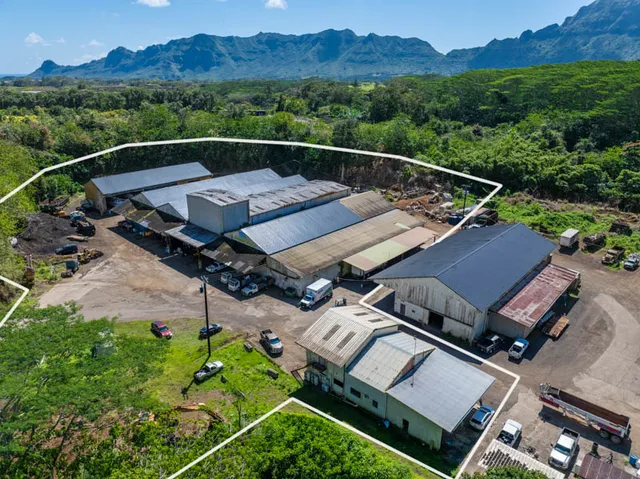 an aerial view of a house with a mountain view