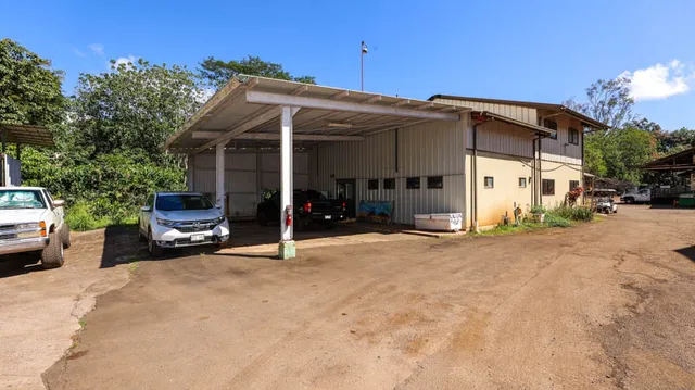 a view of a car park in front of house