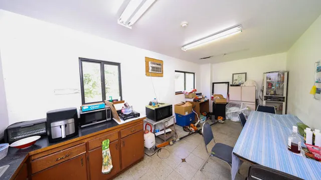 a living room with furniture window and wooden floor