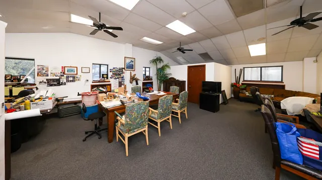 a group of people sitting in living room