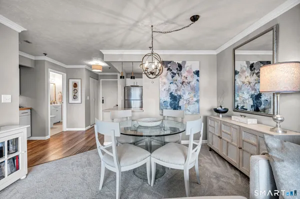 a dining room with furniture and window