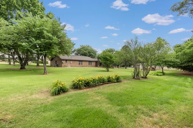 a view of a house with a big yard