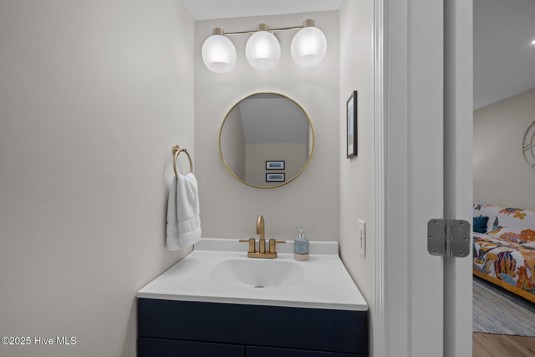 130 Salter Path Road, Unit 73N Pine Knoll Shores, NC 28512 - Photo 27 of 46 Half Bathroom on First Level