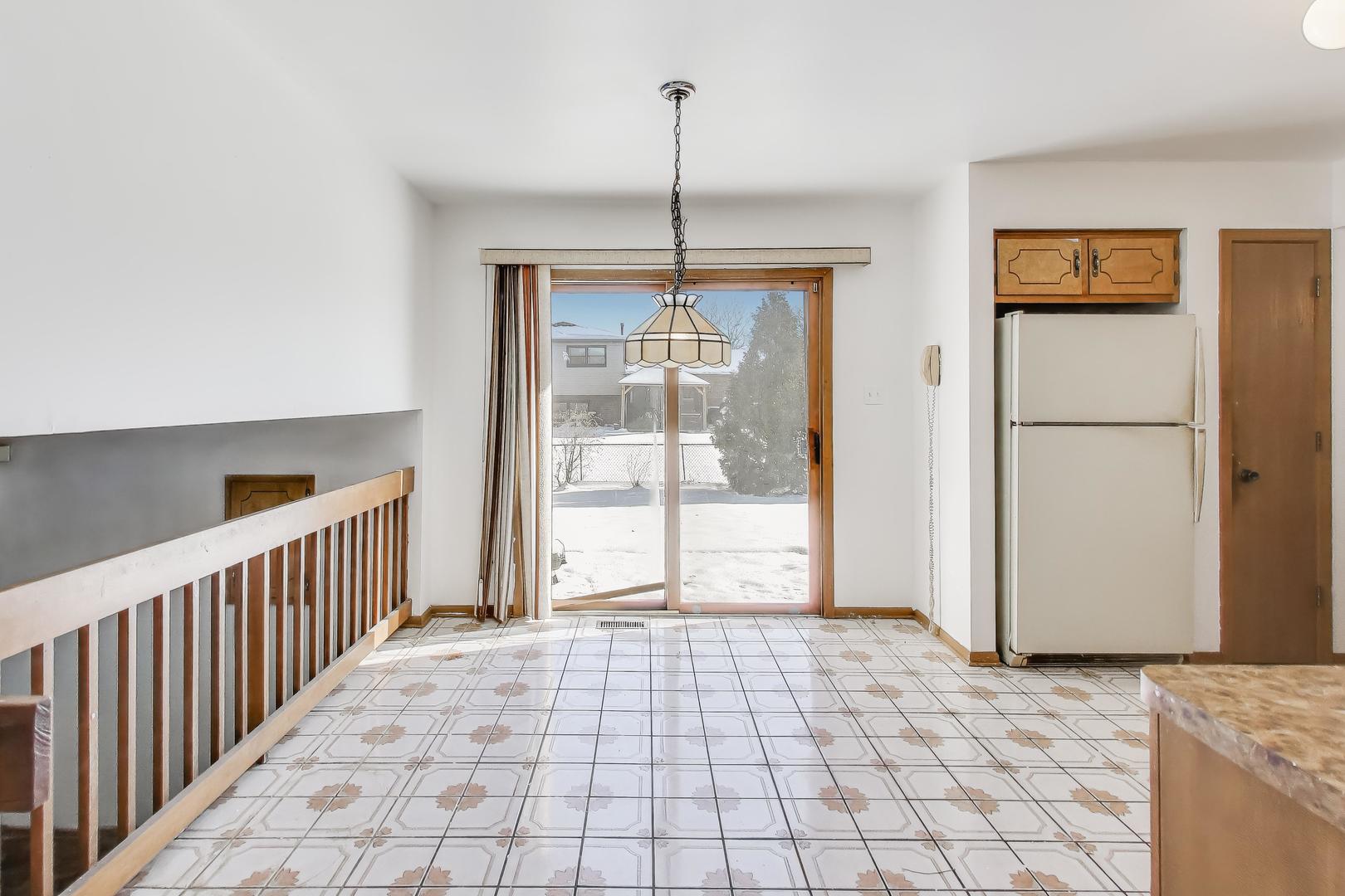 749 Old Farm Road Matteson, IL 60443 - Photo 12 of 34 a view of a room with wooden floor and windows