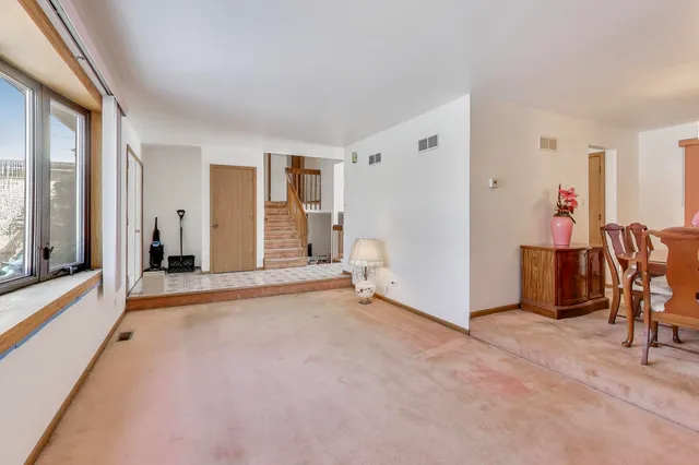 a view of livingroom with furniture and windows