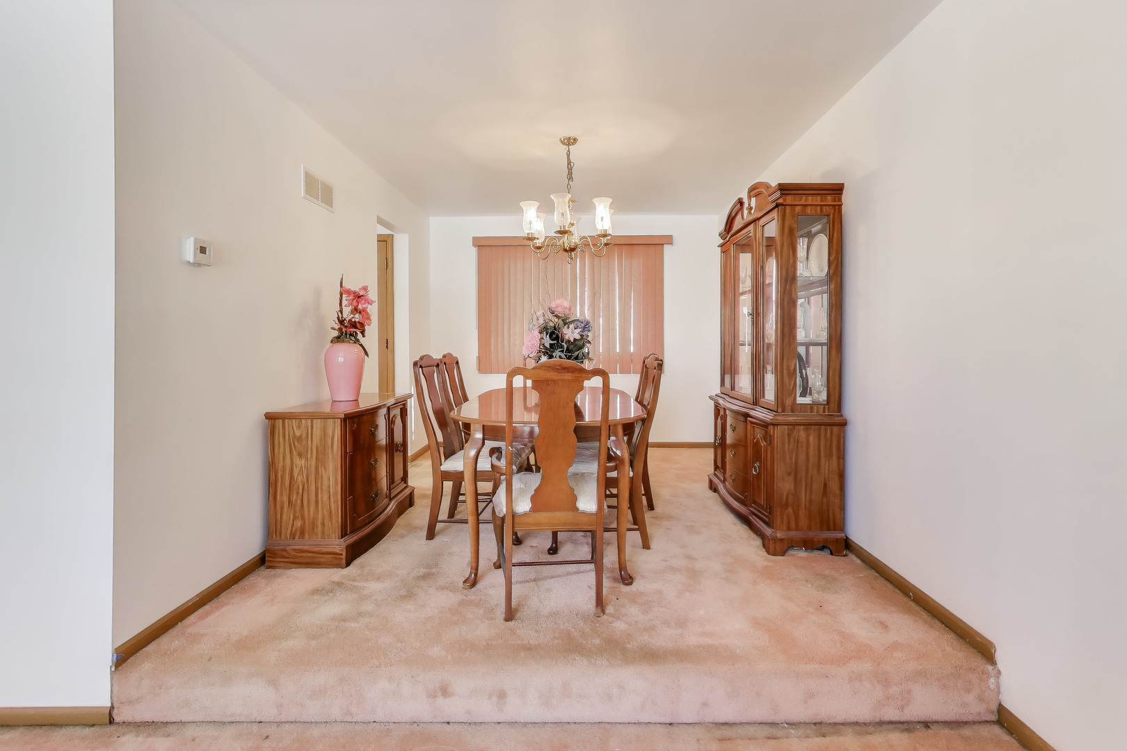 749 Old Farm Road Matteson, IL 60443 - Photo 7 of 34 wooden floor in a hall with a dining table and chairs