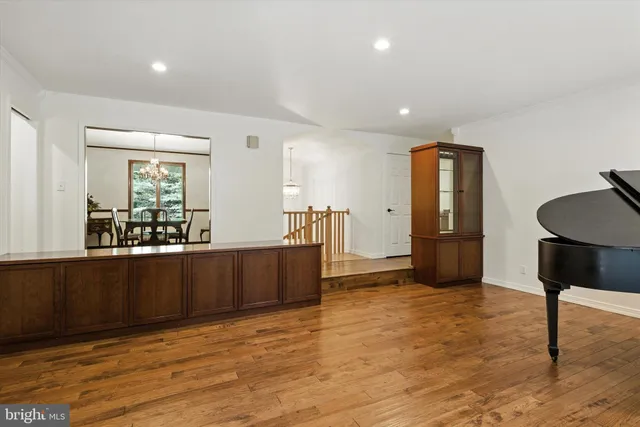 a view of kitchen and hall with wooden floor