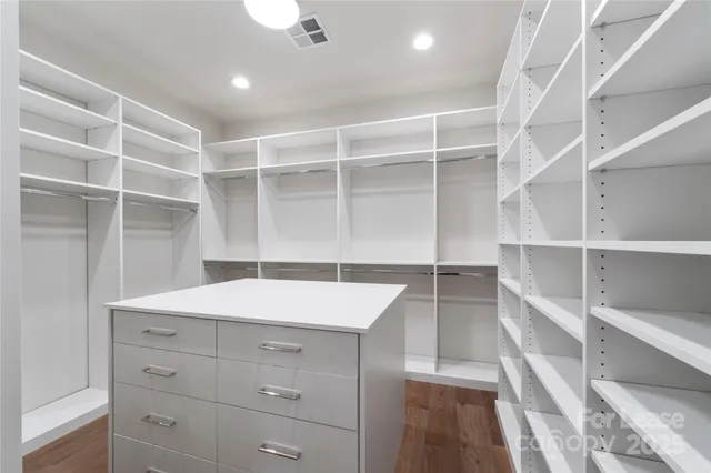a view of cabinets and wooden floor