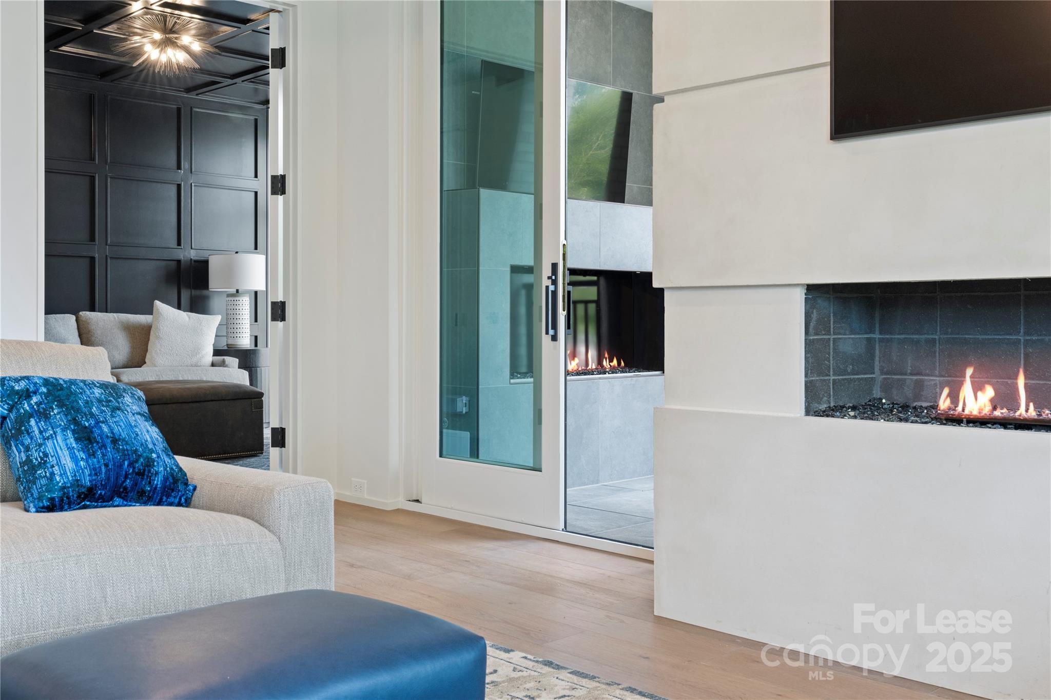 1500 Queens Road, Unit 204 Charlotte, NC 28207 - Photo 17 of 33 a living room with furniture and a fireplace