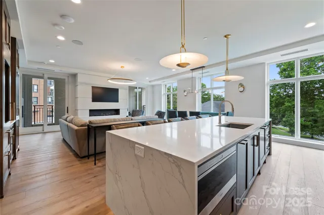 a kitchen with a sink and a refrigerator