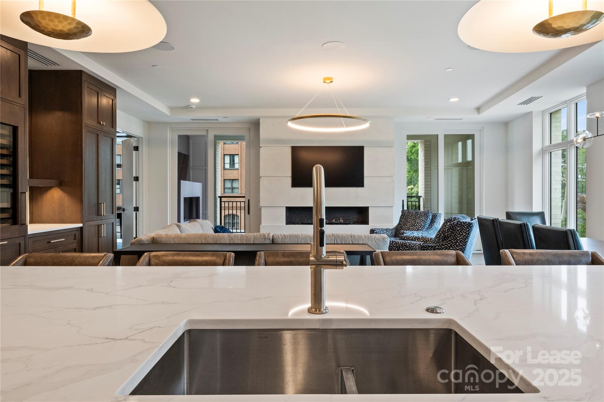 1500 Queens Road, Unit 204 Charlotte, NC 28207 - Photo 20 of 33 a kitchen with a sink and a refrigerator