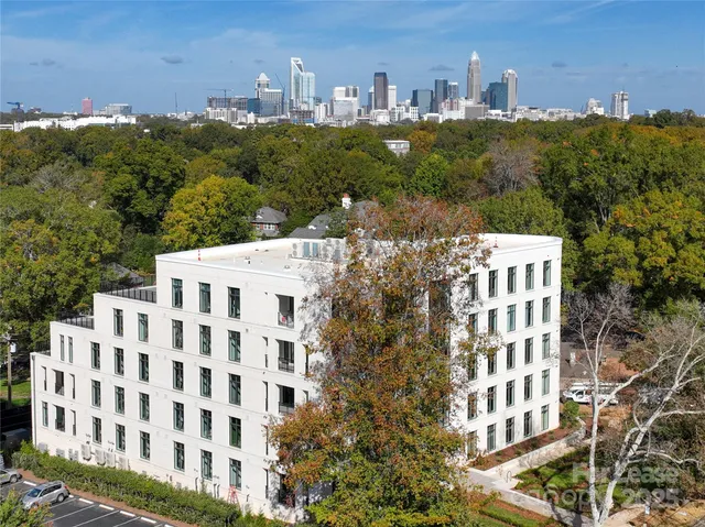 a view of a building with a yard