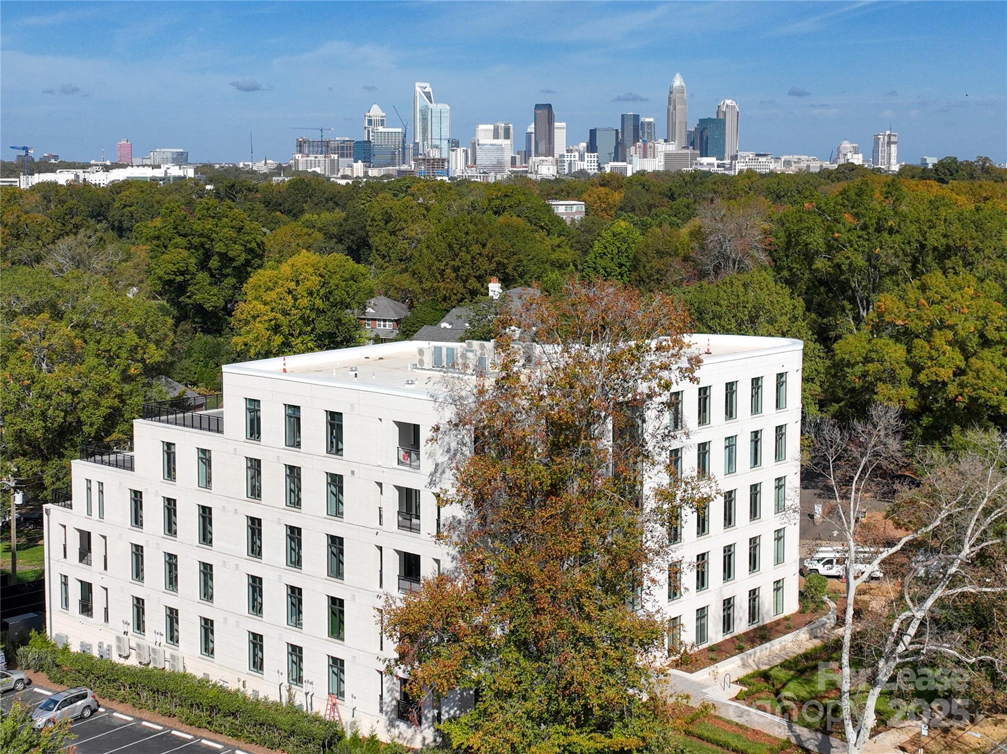 1500 Queens Road, Unit 204 Charlotte, NC 28207 - Photo 2 of 33 a view of a building with a yard