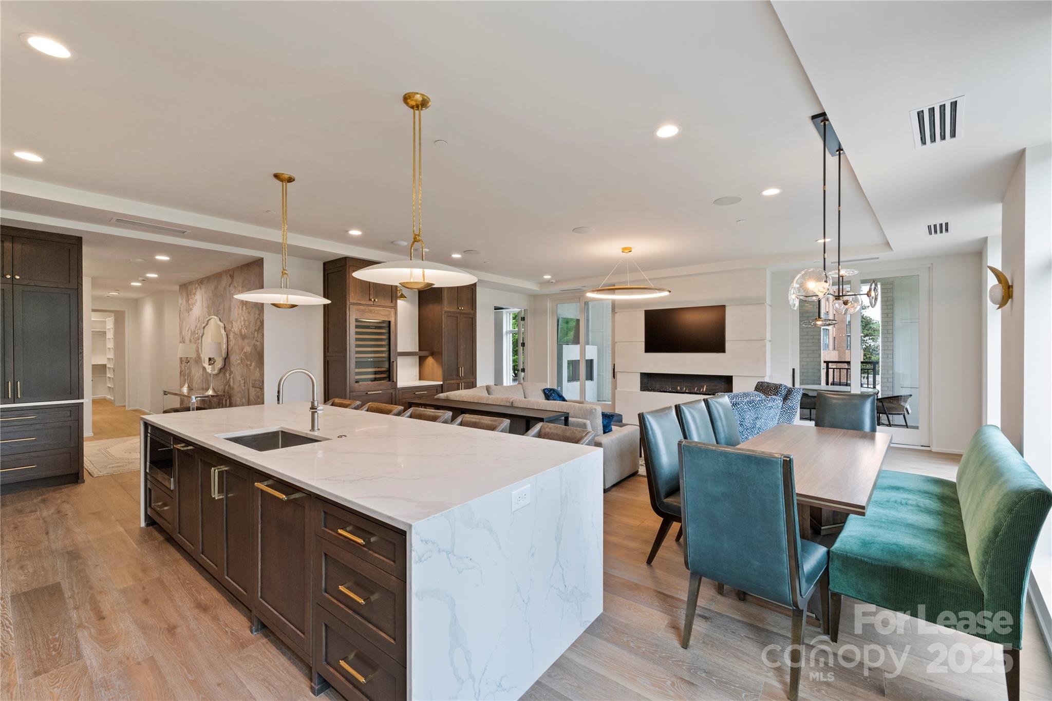 1500 Queens Road, Unit 204 Charlotte, NC 28207 - Photo 21 of 33 a large kitchen with a counter space and stainless steel appliances