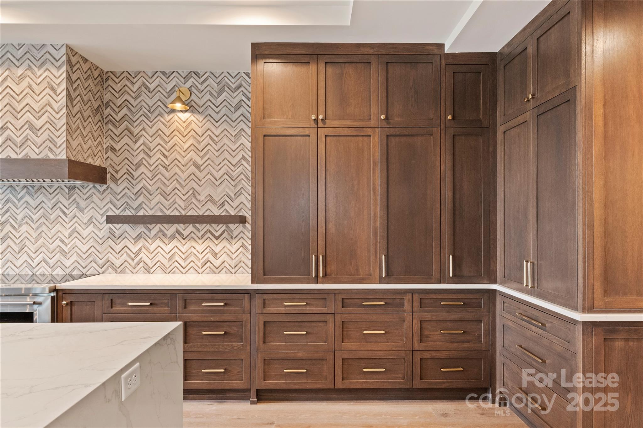 1500 Queens Road, Unit 204 Charlotte, NC 28207 - Photo 23 of 33 a view of a dresser with wooden cabinet