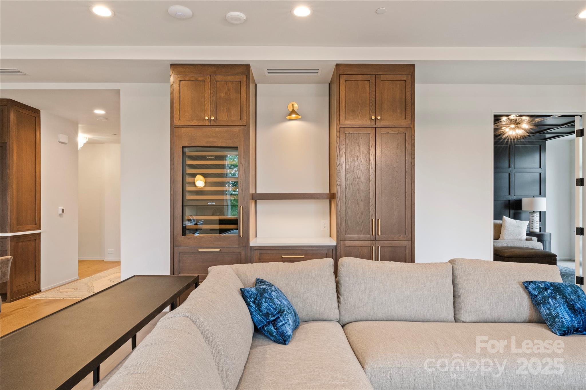 1500 Queens Road, Unit 204 Charlotte, NC 28207 - Photo 24 of 33 a living room with furniture and a window