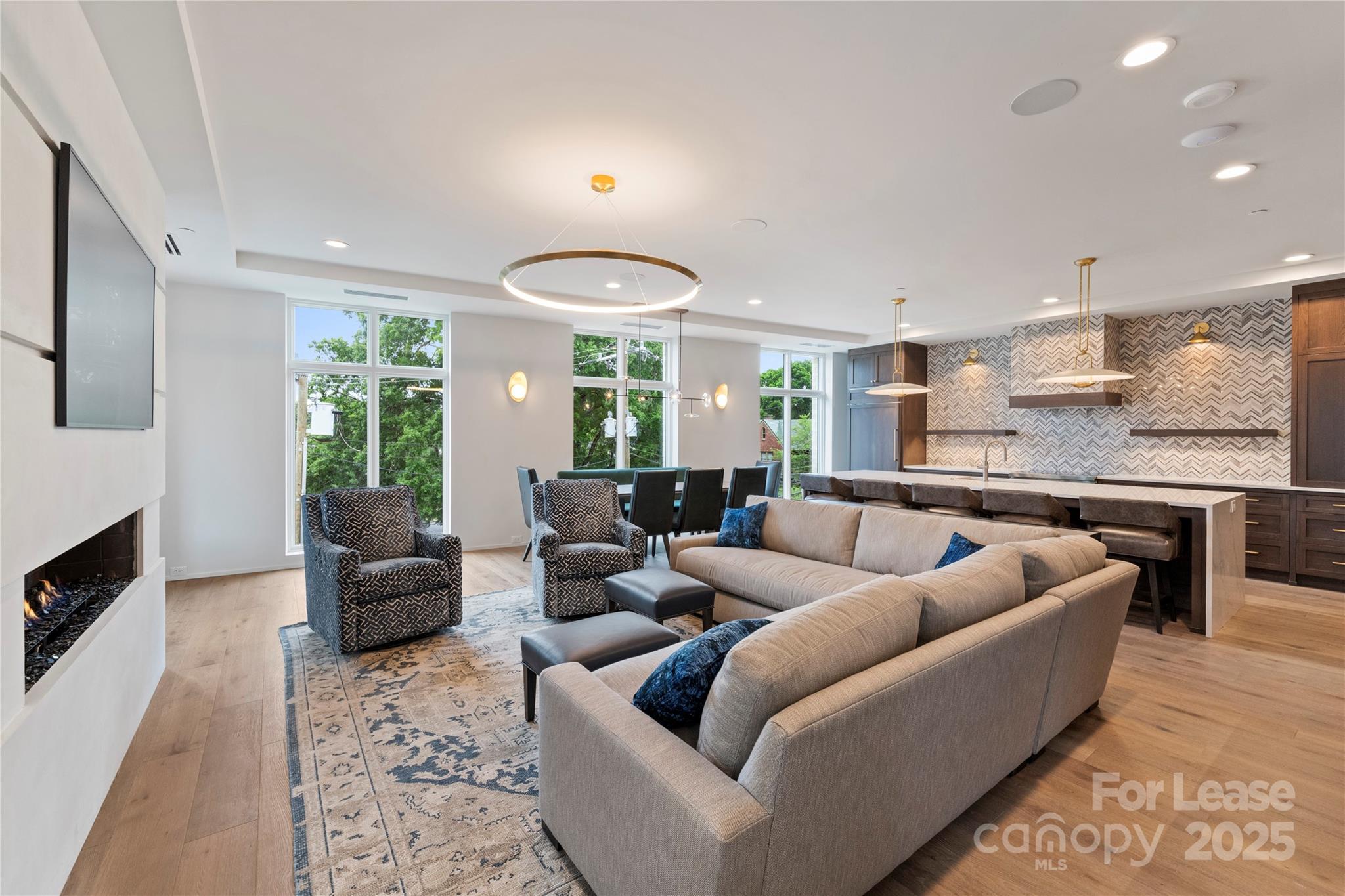 1500 Queens Road, Unit 204 Charlotte, NC 28207 - Photo 26 of 33 a living room with furniture kitchen view and a large window