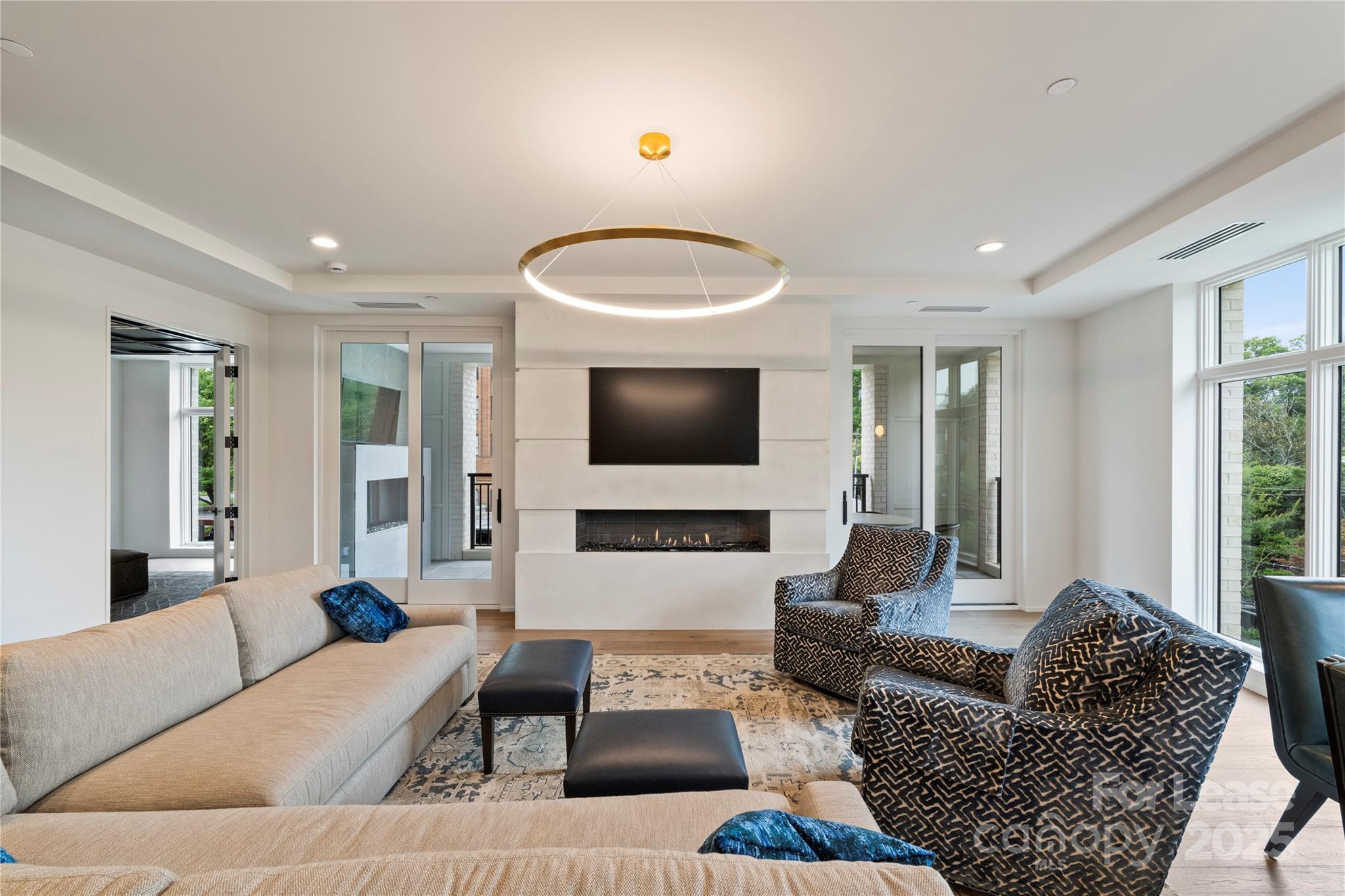 1500 Queens Road, Unit 204 Charlotte, NC 28207 - Photo 3 of 33 a living room with furniture and a flat screen tv