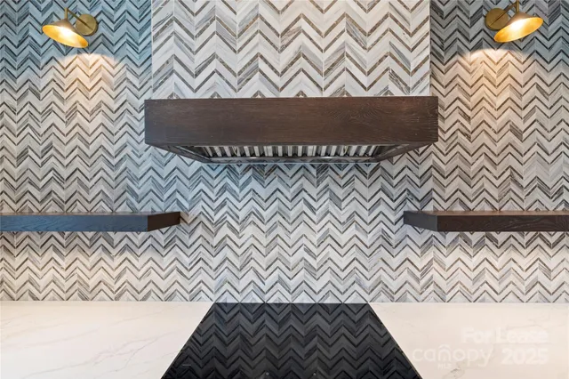 a kitchen with granite countertop a table chairs stove and kitchen view