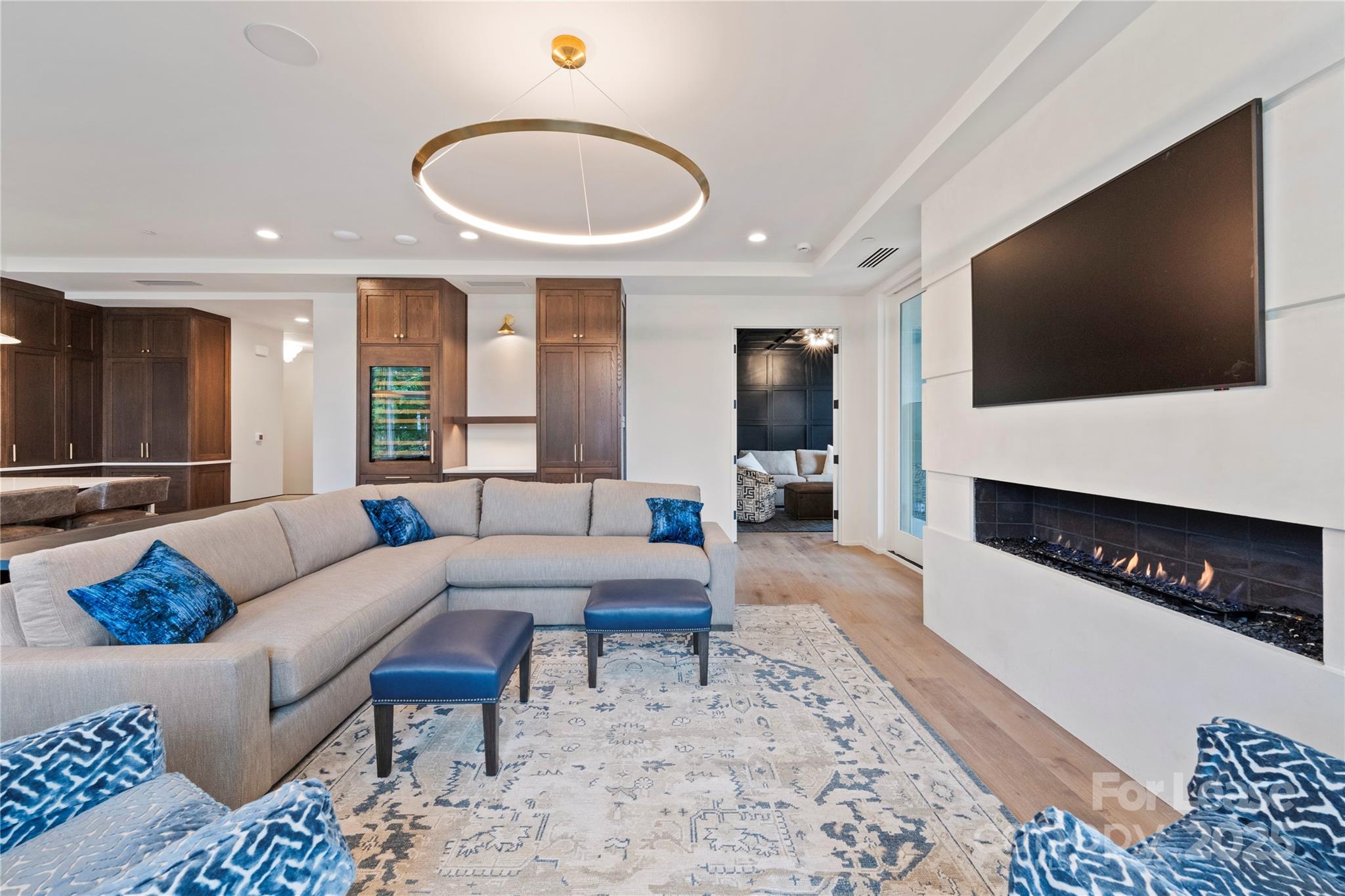 1500 Queens Road, Unit 204 Charlotte, NC 28207 - Photo 8 of 33 a living room with furniture and a flat screen tv