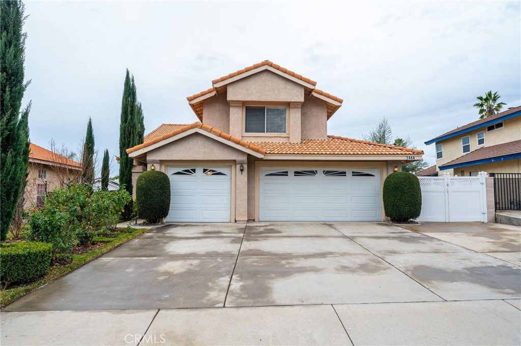 a front view of a house with garage