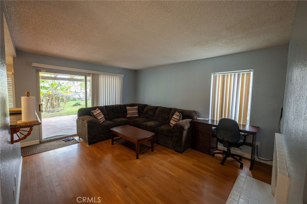 7444 Webster Street Highland, CA 92346 - Photo 15 of 37 a living room with furniture and a window