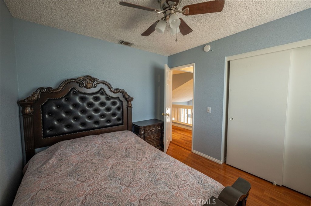7444 Webster Street Highland, CA 92346 - Photo 21 of 37 a bedroom with a bed and a window