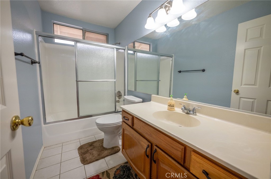 7444 Webster Street Highland, CA 92346 - Photo 22 of 37 a bathroom with a sink toilet and shower