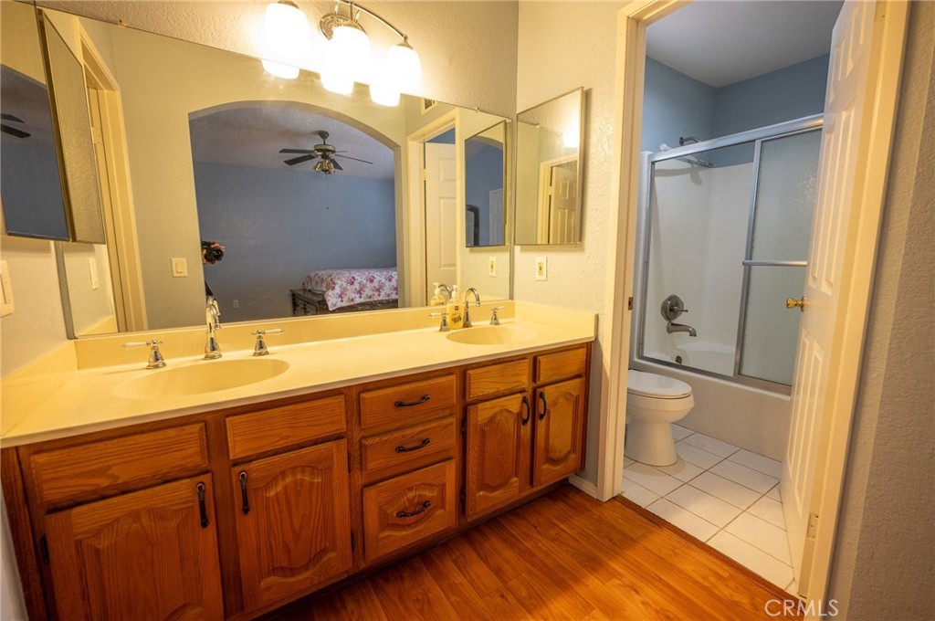 7444 Webster Street Highland, CA 92346 - Photo 24 of 37 a spacious bathroom with a double vanity sink toilet mirror and bathtub